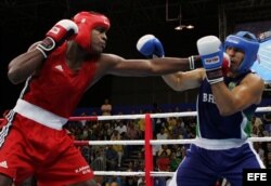 Robert Alfonso se enfrenta al brasileño Antonio Nogueira (i-d), por las semifinales de la categoría +91 kg, en los Juegos Panamericanos Río de Janeiro 2007.